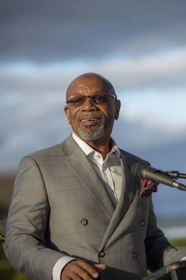 Dr. Miles K. Davis speaking at a podium
